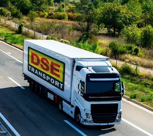DSE Transport branded rigid truck travelling along an Australian road
